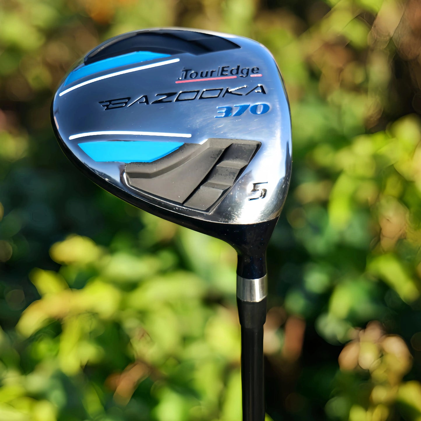 Tour Edge Golf Fairway clubs with high COR face for enhanced distance and consistency, set against a lush green background.